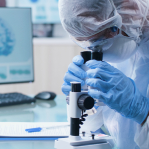 Scientist chemist researcher doctor analyzing dna sample using medical microscope